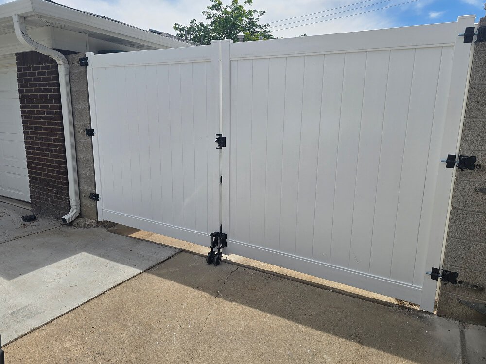 White double vinyl privacy gate in driveway in Albuquerque NM